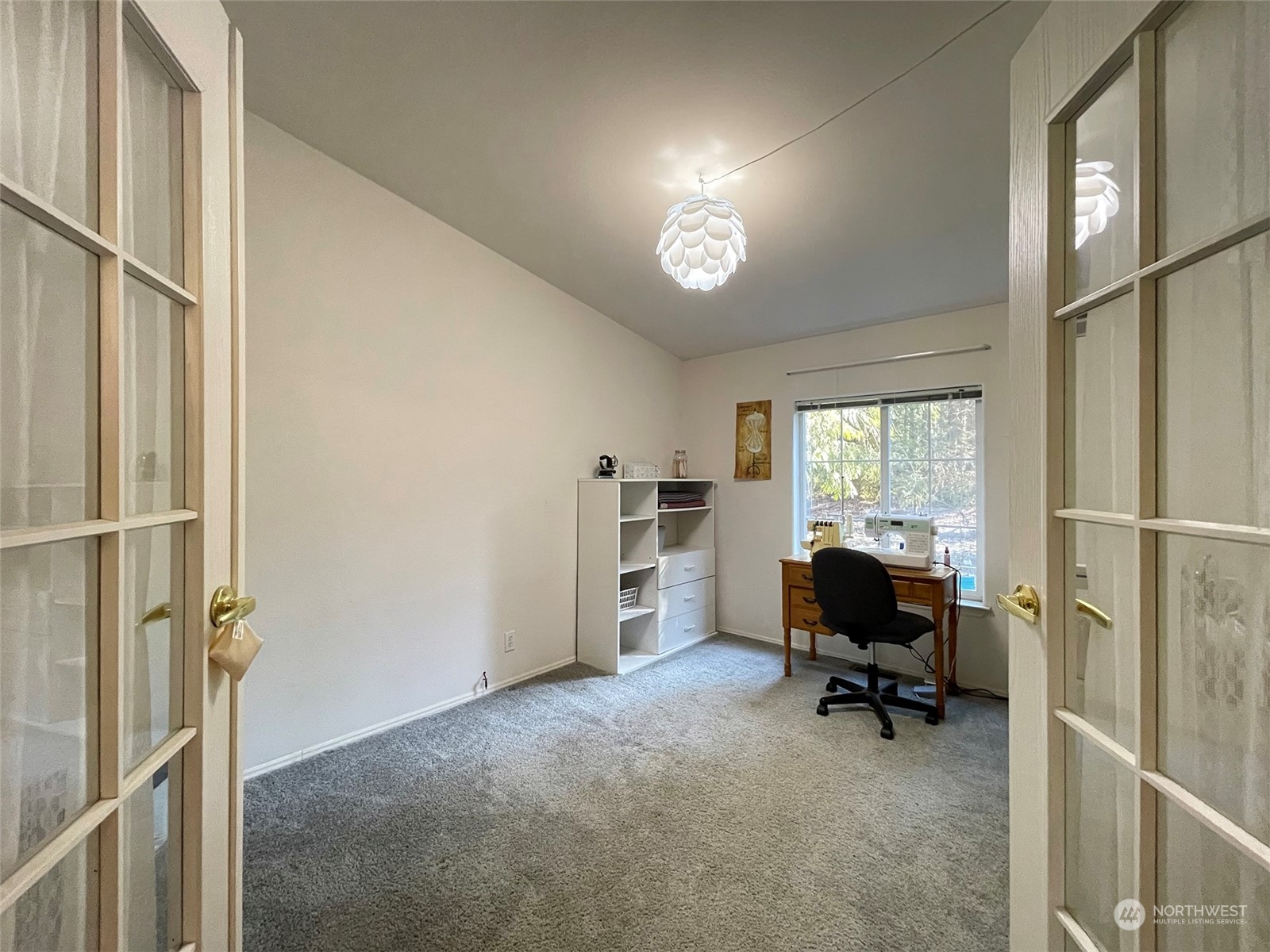 297 Amarillo Road Port Angeles, WA 98362 - Photo 17 of 40 a view of a workspace with furniture and a window
