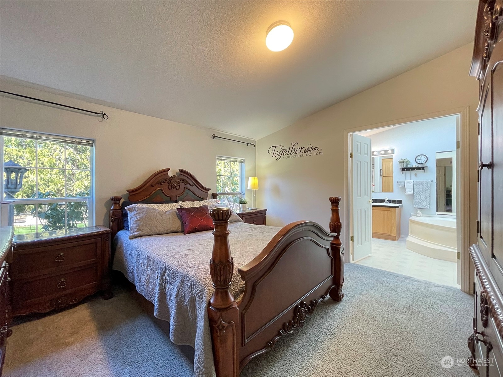 297 Amarillo Road Port Angeles, WA 98362 - Photo 19 of 40 a spacious bedroom with a bed and window