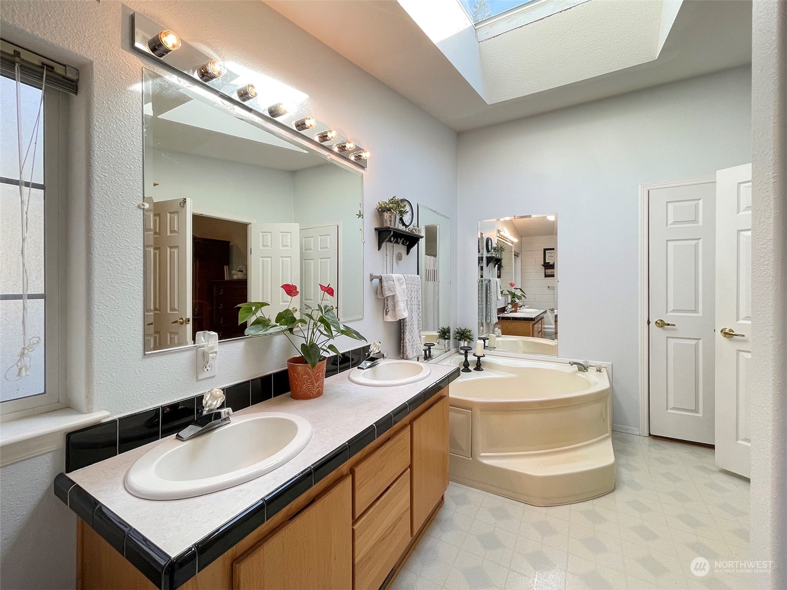 297 Amarillo Road Port Angeles, WA 98362 - Photo 22 of 40 a bathroom with a sink and a mirror