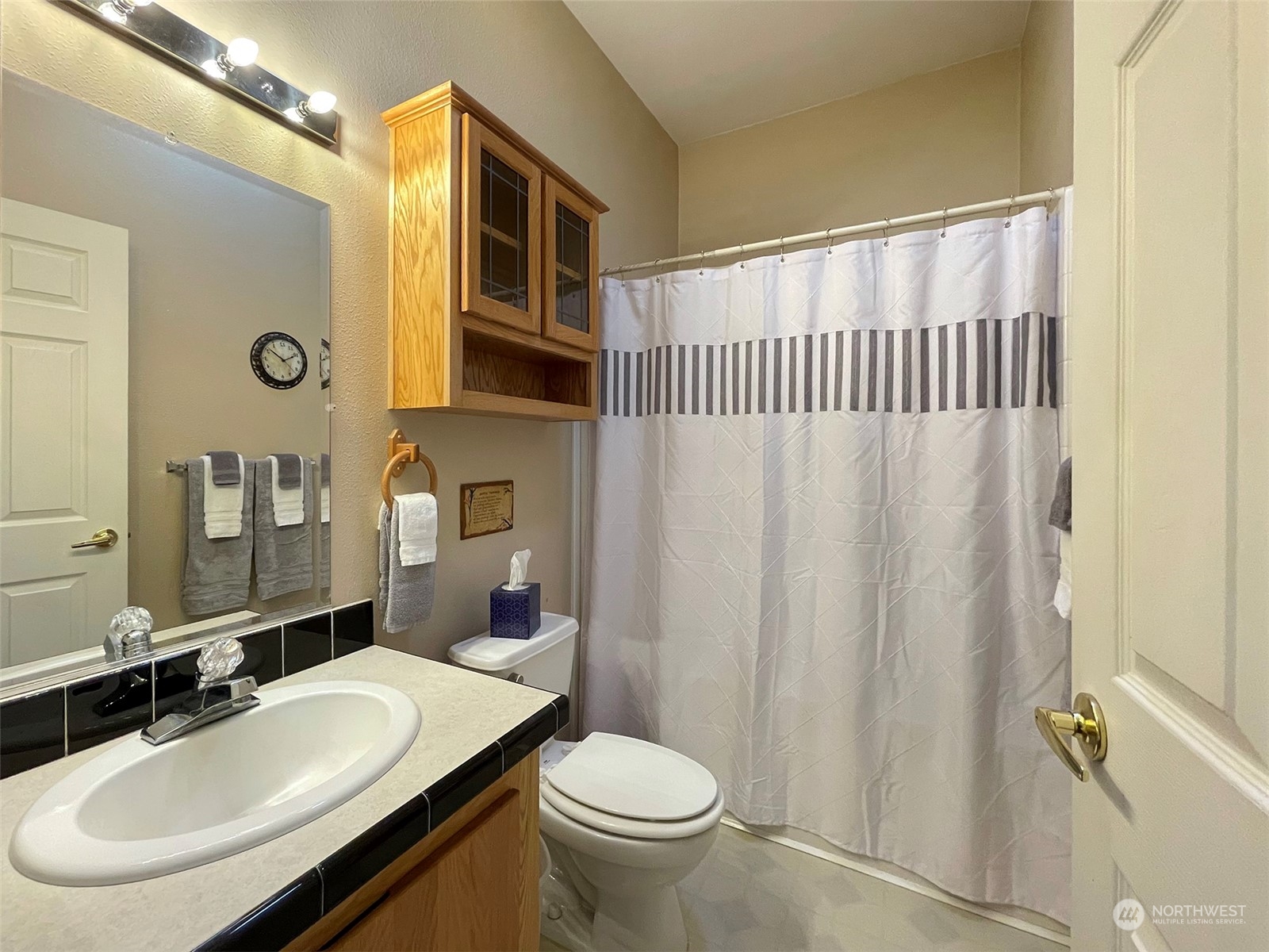297 Amarillo Road Port Angeles, WA 98362 - Photo 27 of 40 a bathroom with a sink toilet and shower