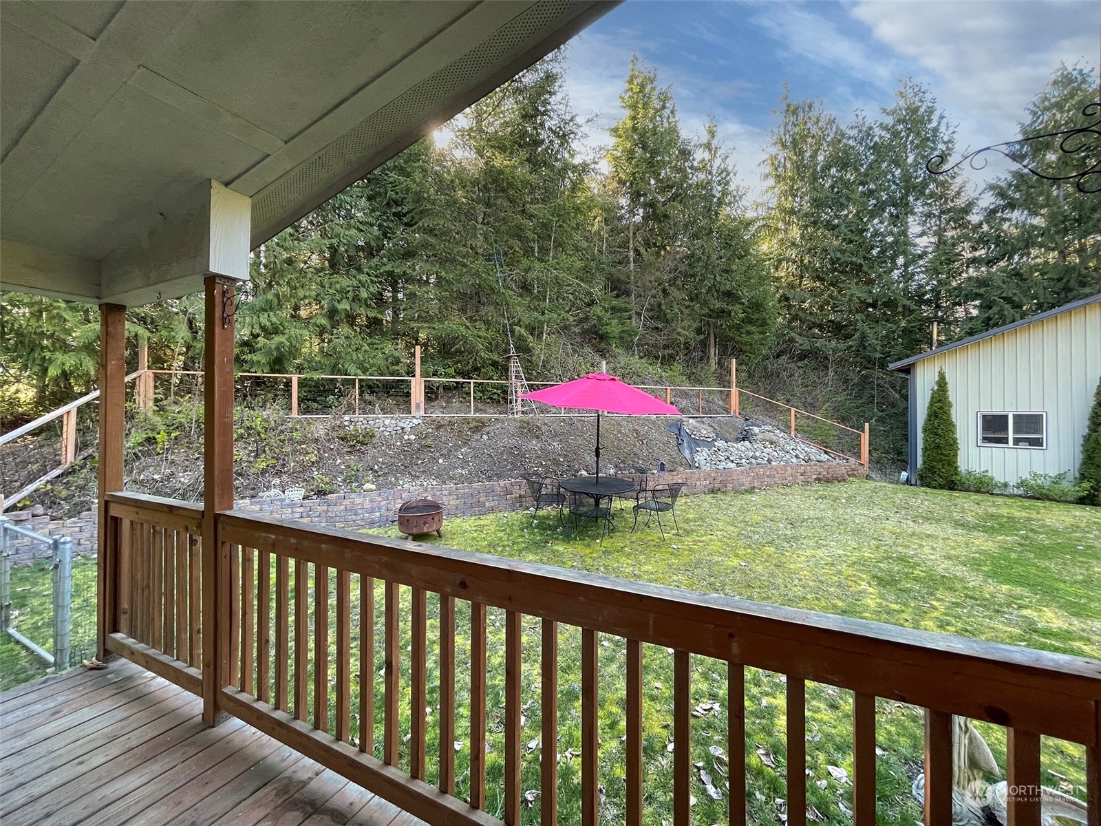 297 Amarillo Road Port Angeles, WA 98362 - Photo 30 of 40 a view of a small yard and a wooden deck