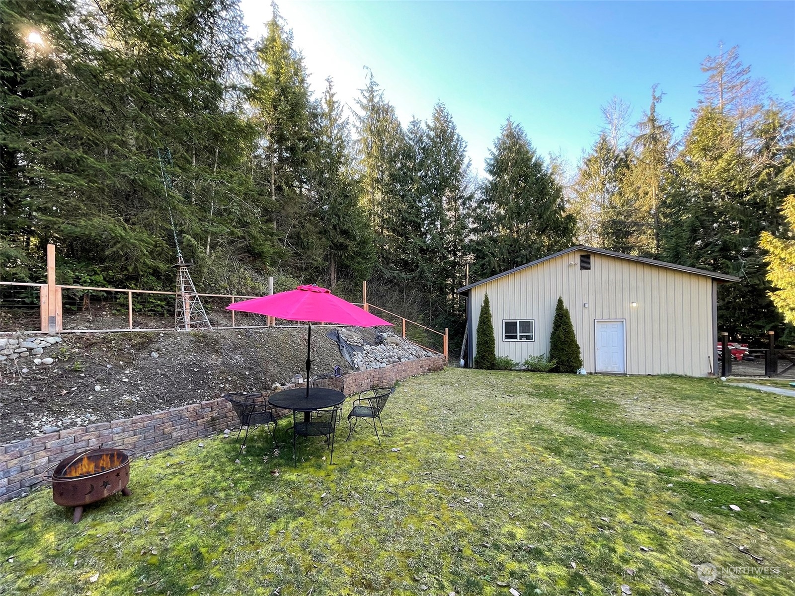 297 Amarillo Road Port Angeles, WA 98362 - Photo 31 of 40 a view of a backyard with a tub and slide