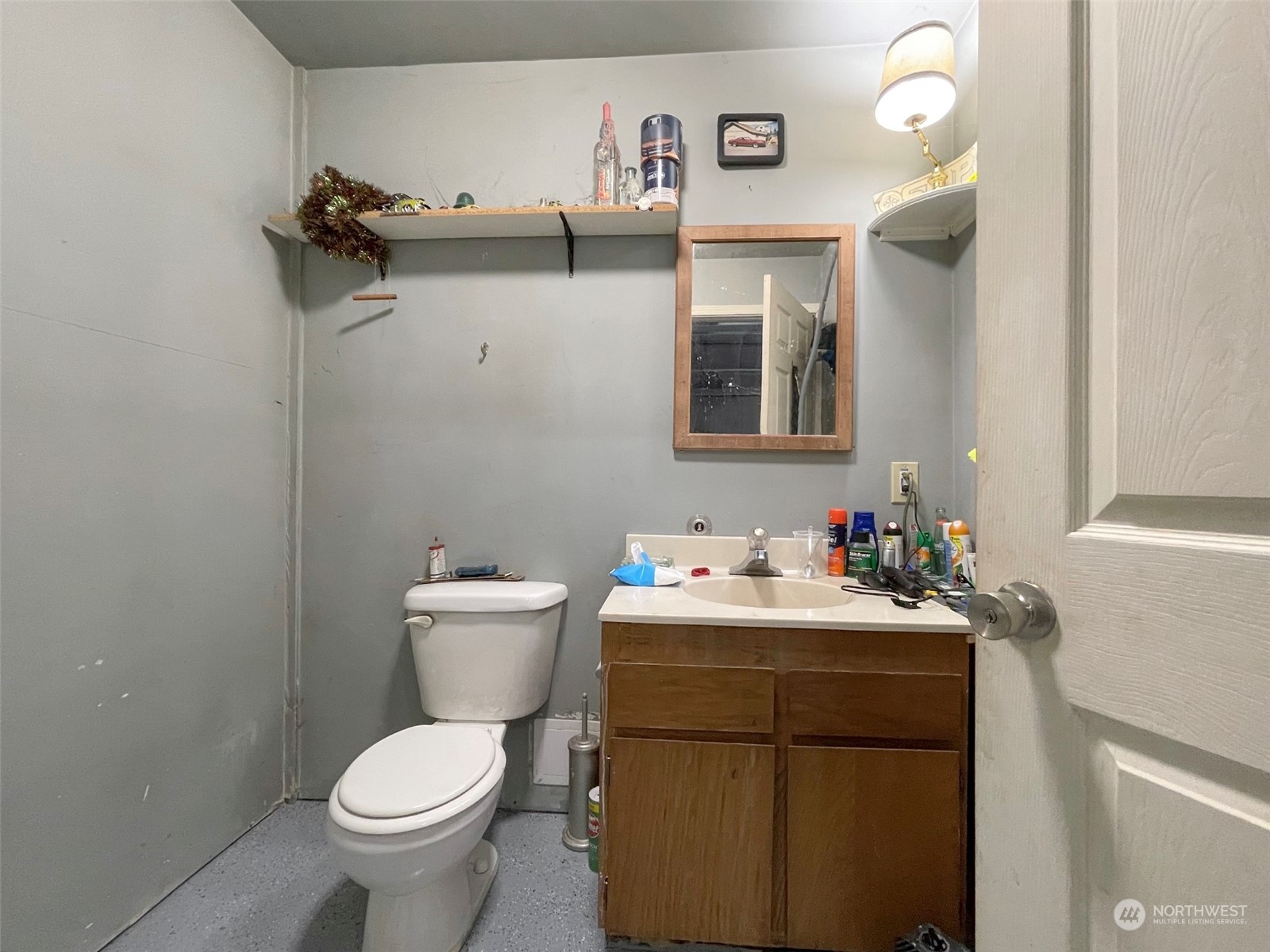 297 Amarillo Road Port Angeles, WA 98362 - Photo 38 of 40 a bathroom with a toilet sink and mirror