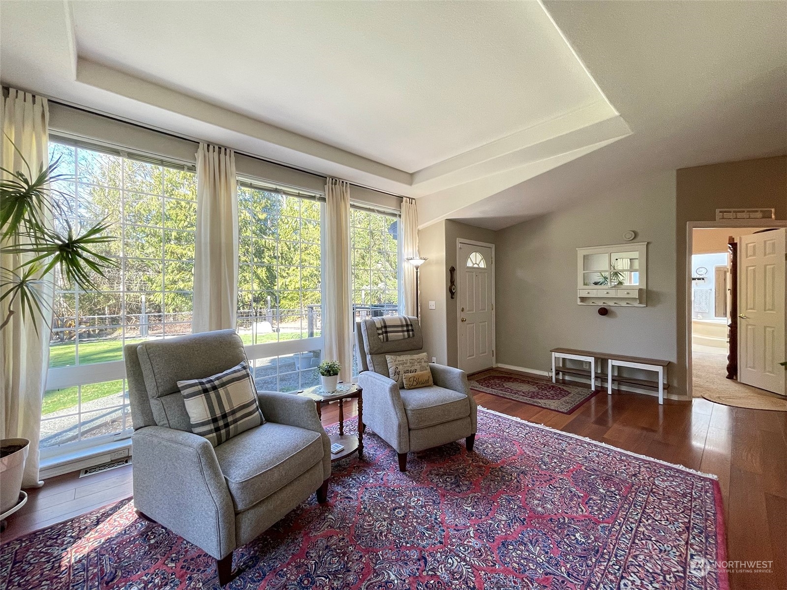 297 Amarillo Road Port Angeles, WA 98362 - Photo 6 of 40 a living room with furniture rug and a large window
