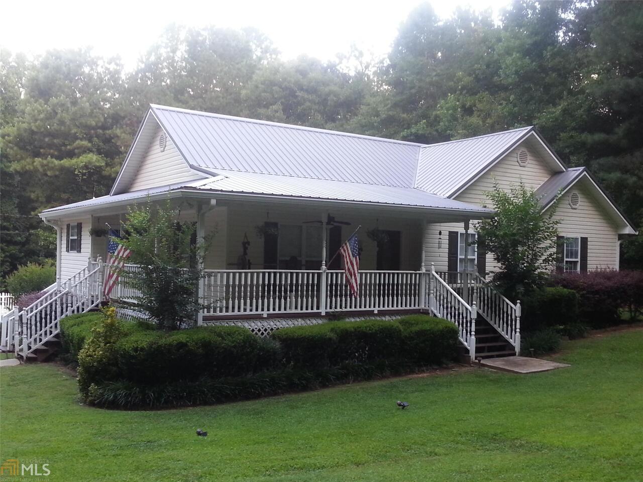 4016 South River Road Franklin, GA 30217 - Photo 1 of 1 a front view of a house with a garden