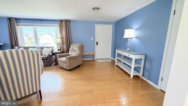 508 Lloyd Street Ocean View, DE 19970 - Photo 2 of 29 a living room with furniture and a flat screen tv