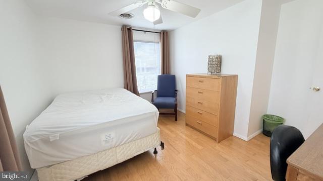 508 Lloyd Street Ocean View, DE 19970 - Photo 22 of 29 a spacious bedroom with a bed and a chair
