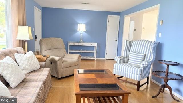 508 Lloyd Street Ocean View, DE 19970 - Photo 3 of 29 a living room with furniture and a lamp