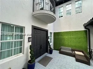 a backyard of a house with seating space