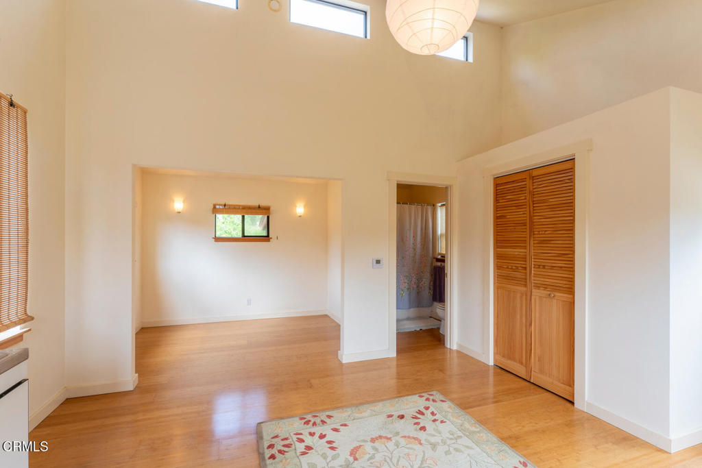 30470 Pudding Creek Road Fort Bragg, CA 95437 - Photo 26 of 34 a view of a hallway with bathroom and wooden floor