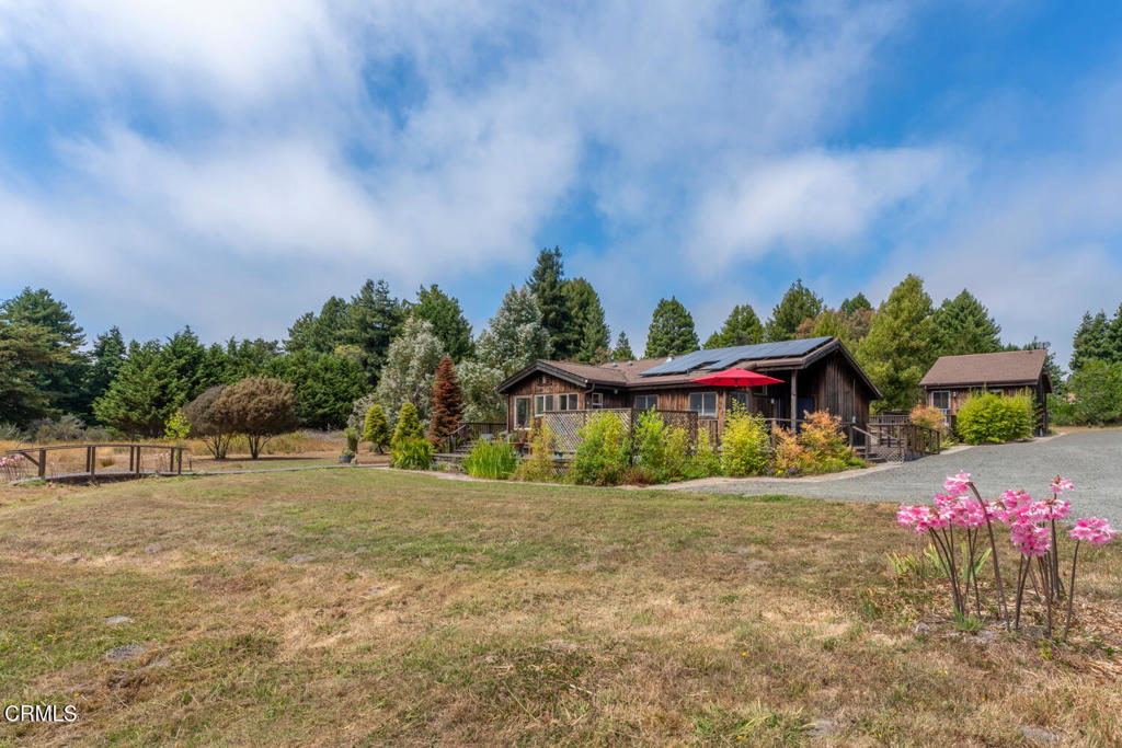 30470 Pudding Creek Road Fort Bragg, CA 95437 - Photo 28 of 34 a backyard of a house with table and chairs