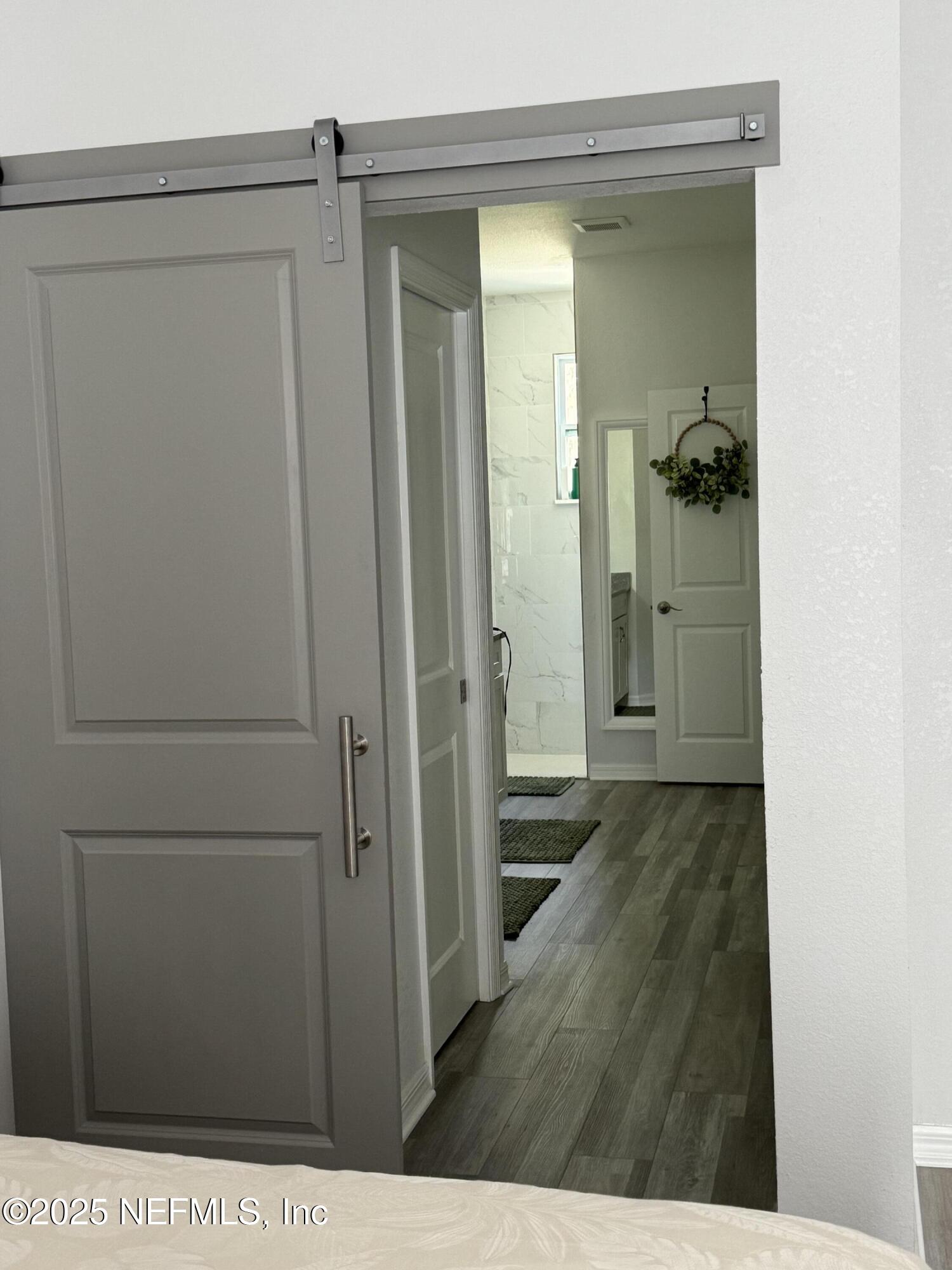 240 Ashley Street Hawthorne, FL 32640 - Photo 9 of 39 Barn door ro Primary Bath