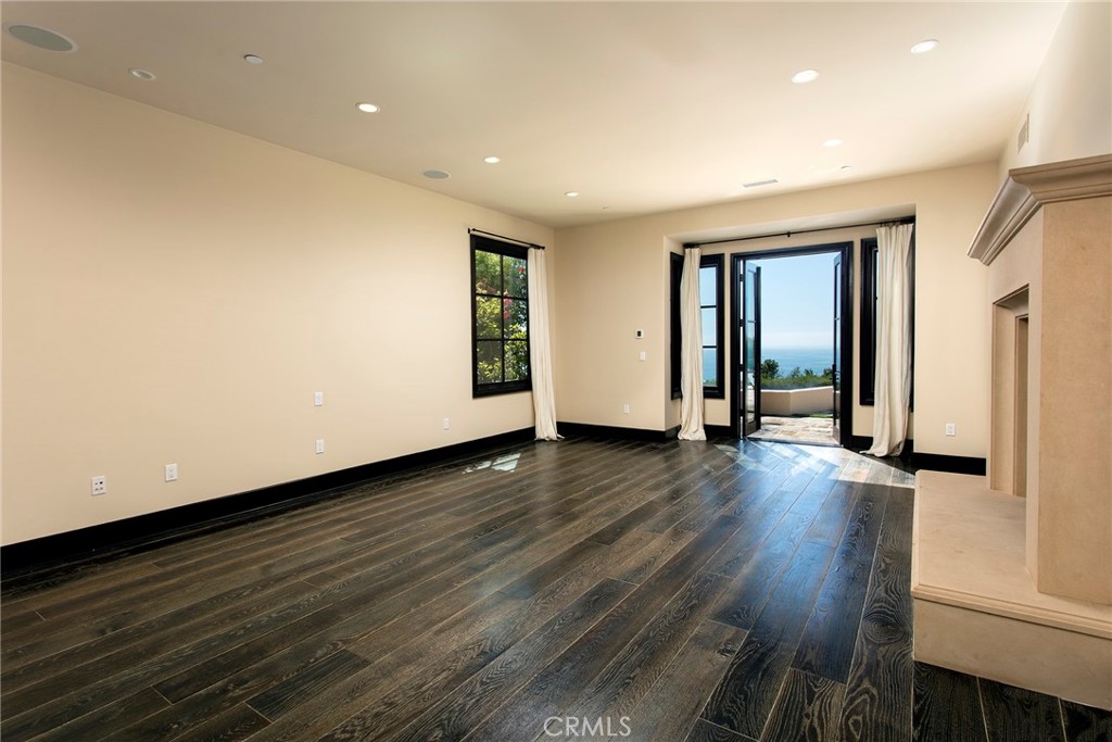 5 Currents Newport Coast, CA 92657 - Photo 16 of 36 a view of a room with wooden floor and window