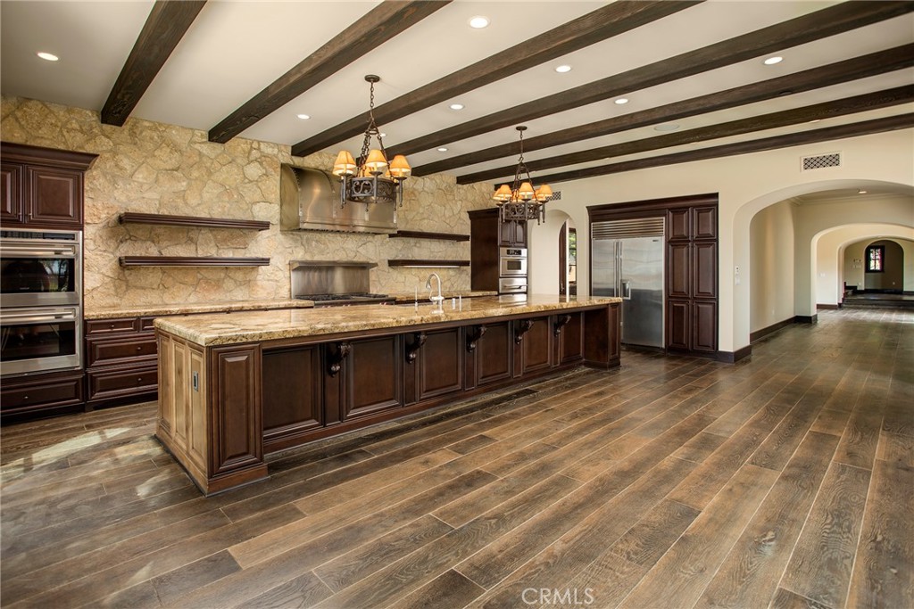 5 Currents Newport Coast, CA 92657 - Photo 8 of 36 a kitchen with stainless steel appliances granite countertop a stove and a sink