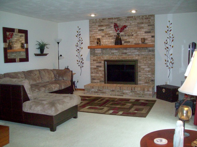 1180 Lewis Road Geneva, IL 60134 - Photo 12 of 25 a living room with furniture and a fireplace