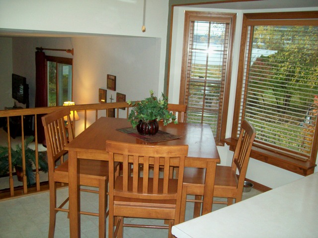 1180 Lewis Road Geneva, IL 60134 - Photo 15 of 25 a dining room with furniture window and wooden floor