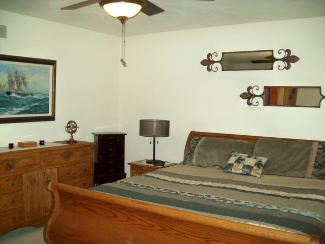 1180 Lewis Road Geneva, IL 60134 - Photo 18 of 25 a bedroom with a bed and a table