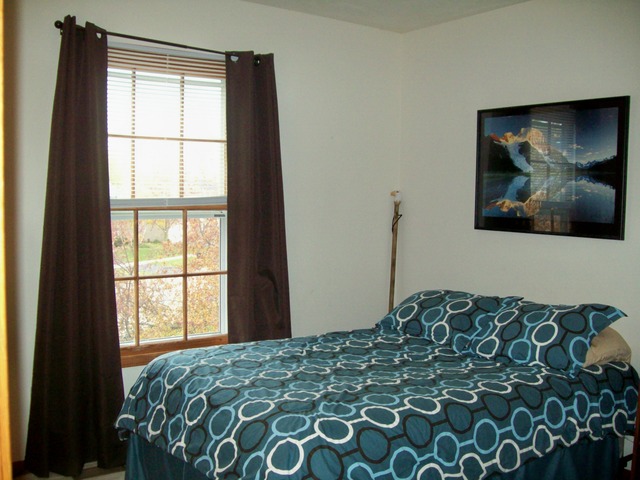 1180 Lewis Road Geneva, IL 60134 - Photo 19 of 25 a bedroom with a bed and a window