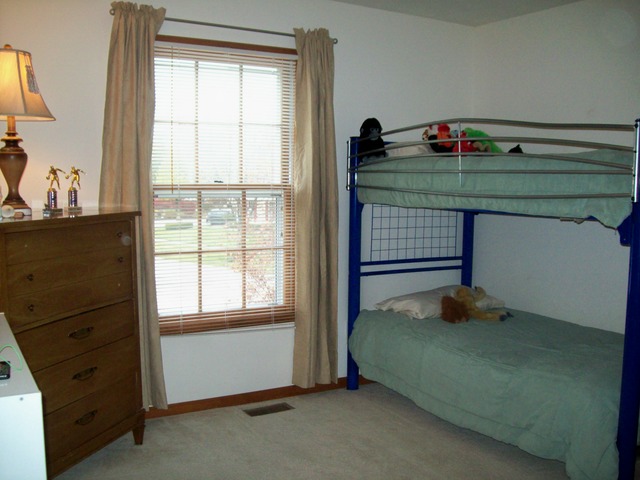 1180 Lewis Road Geneva, IL 60134 - Photo 20 of 25 a bedroom with a bed and a window