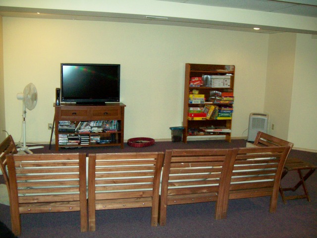 1180 Lewis Road Geneva, IL 60134 - Photo 22 of 25 a living room with furniture and a flat screen tv
