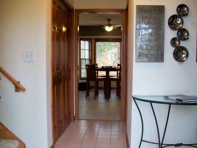 1180 Lewis Road Geneva, IL 60134 - Photo 9 of 25 an entryway of a house and livingroom with furniture