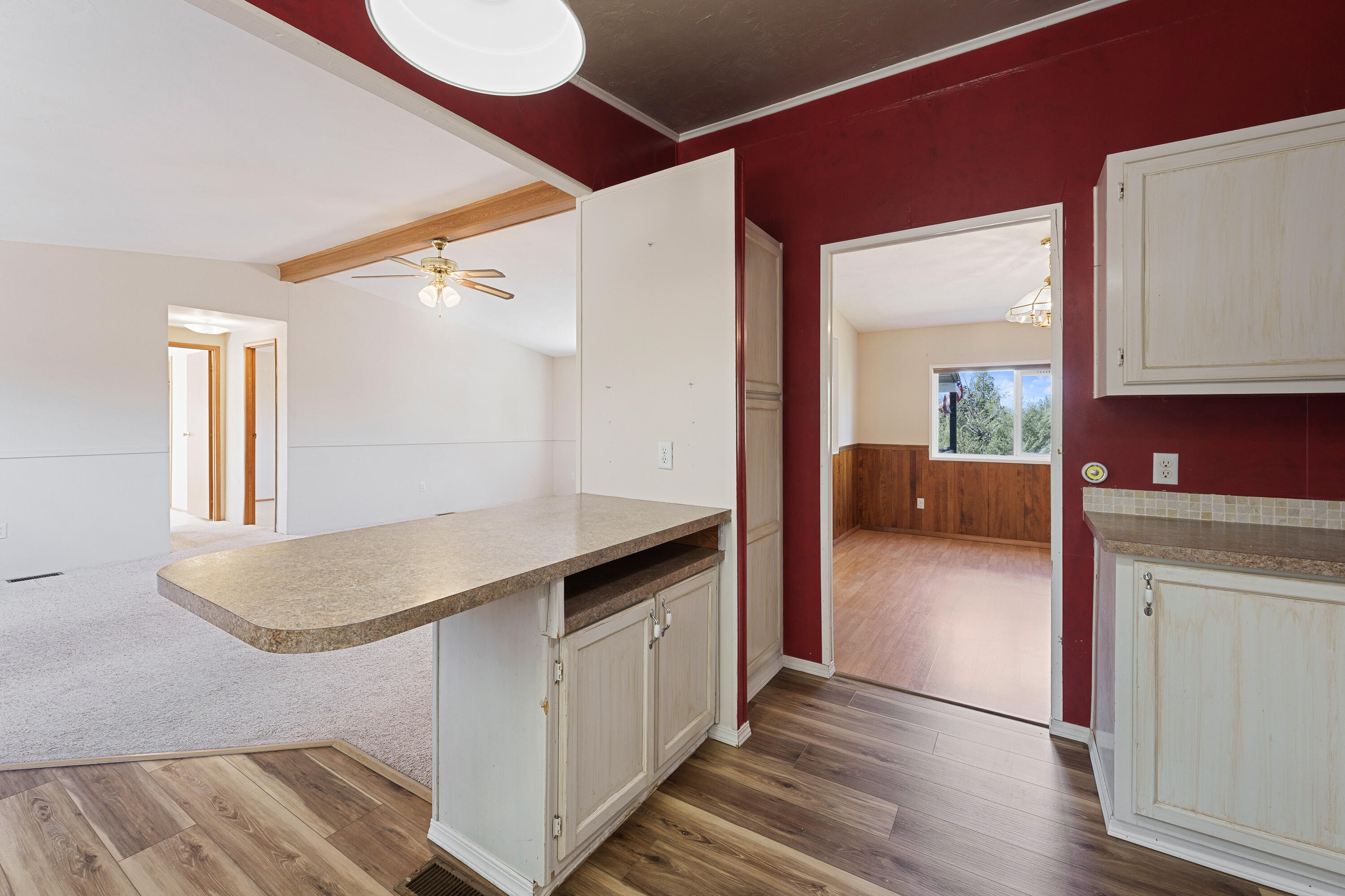 5674 Southeast Davis Loop Prineville, OR 97754 - Photo 14 of 48 a kitchen with kitchen island a counter top space a sink stainless steel appliances and cabinets