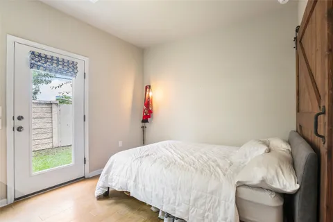 a bedroom with a workspace