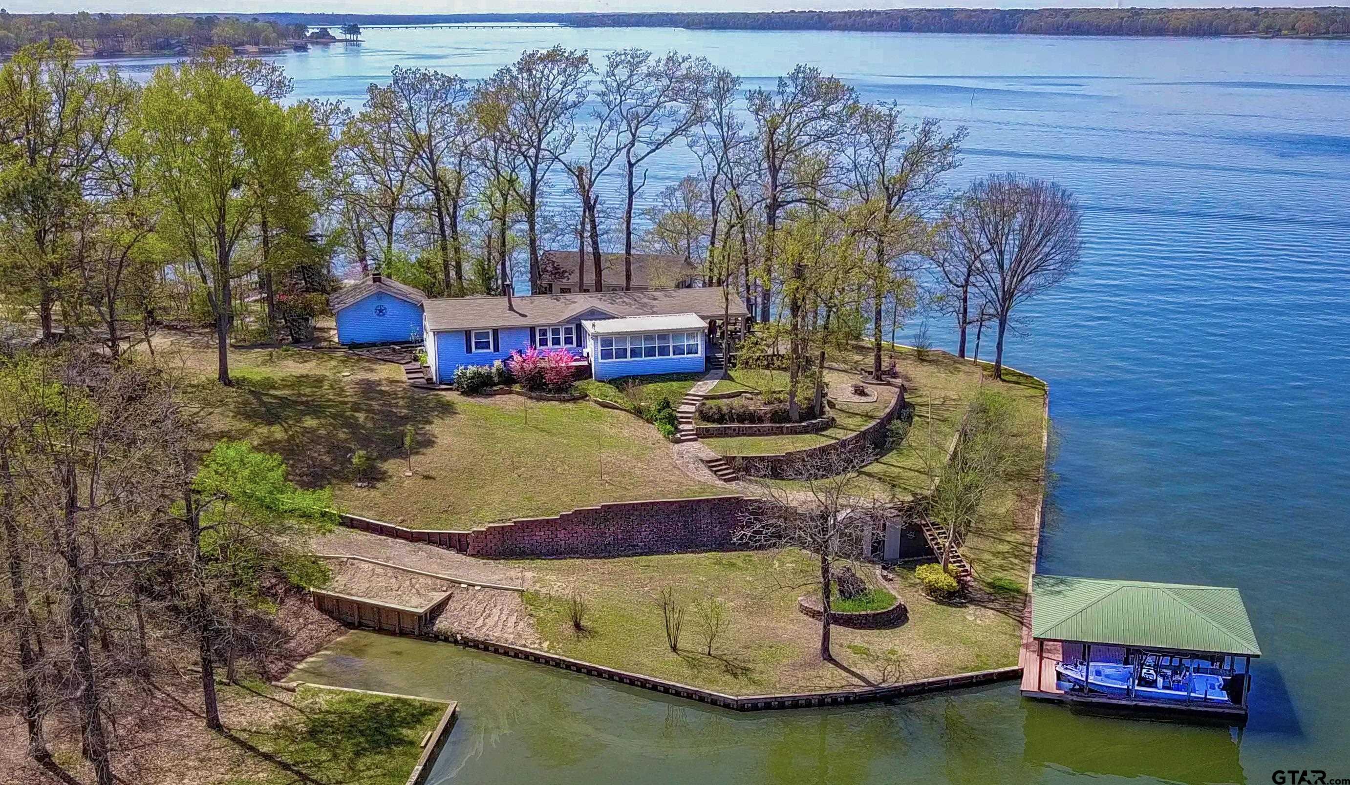 a swimming pool with some trees in the background