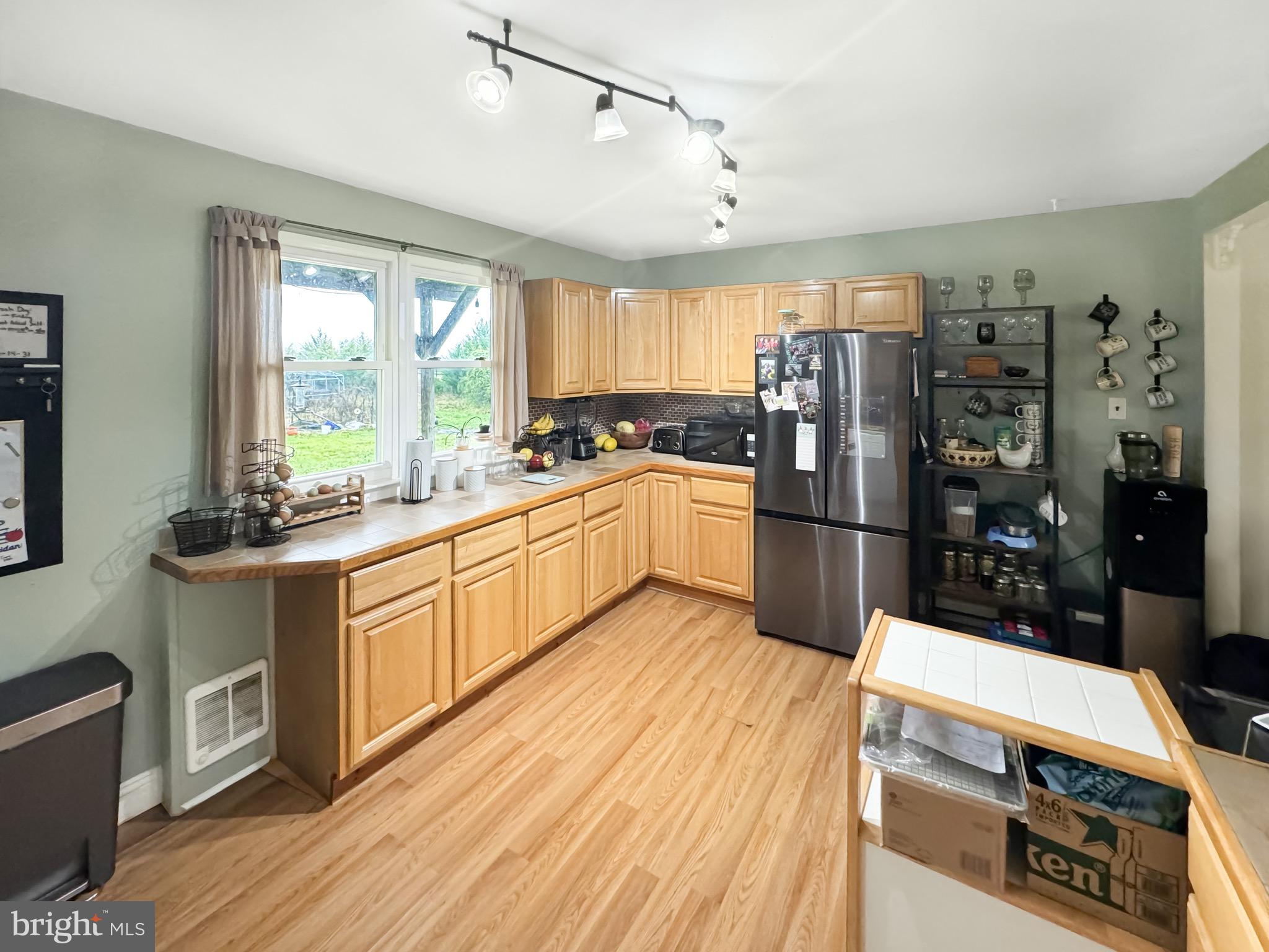56 Gilbert Road Bordentown, NJ 08505 - Photo 4 of 16 a kitchen with stainless steel appliances a stove sink and refrigerator