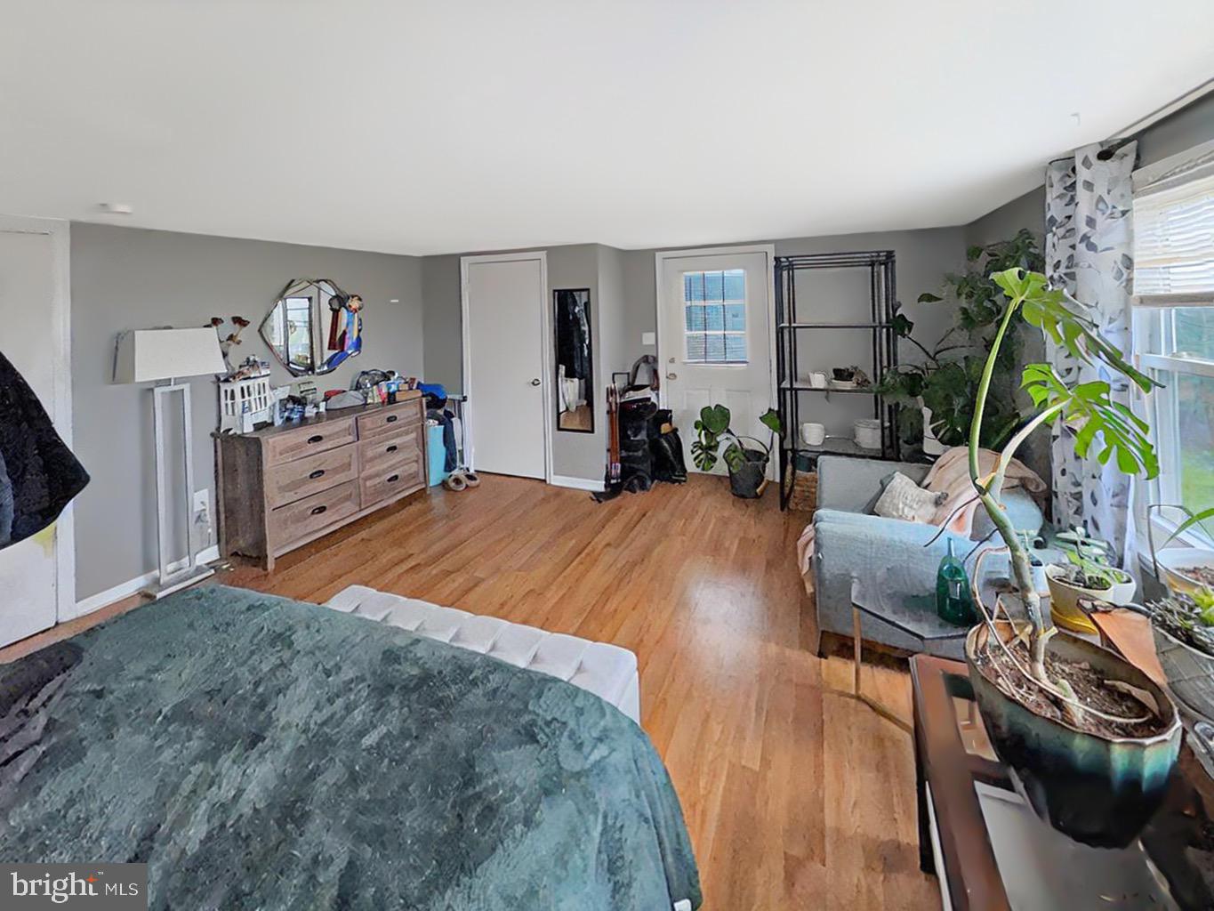 56 Gilbert Road Bordentown, NJ 08505 - Photo 8 of 16 a bedroom with furniture and a wooden floor