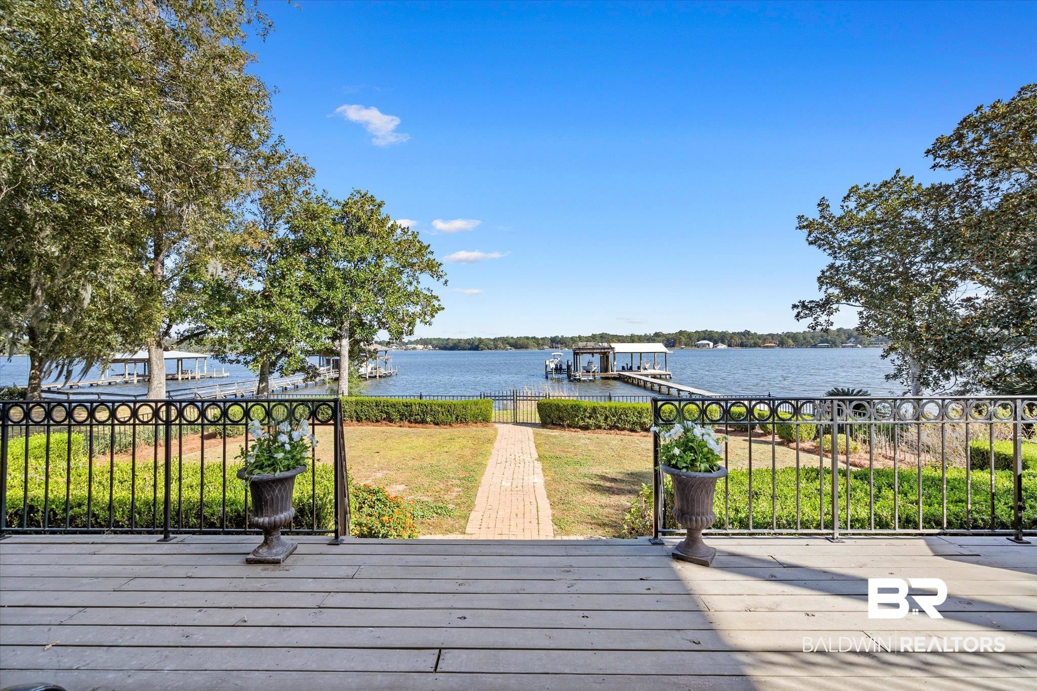 4930 River Trace Theodore, AL 36582 - Photo 7 of 57 Deck with a dock and a water view