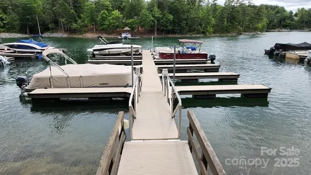 a view of a lake with boats and trees in the background