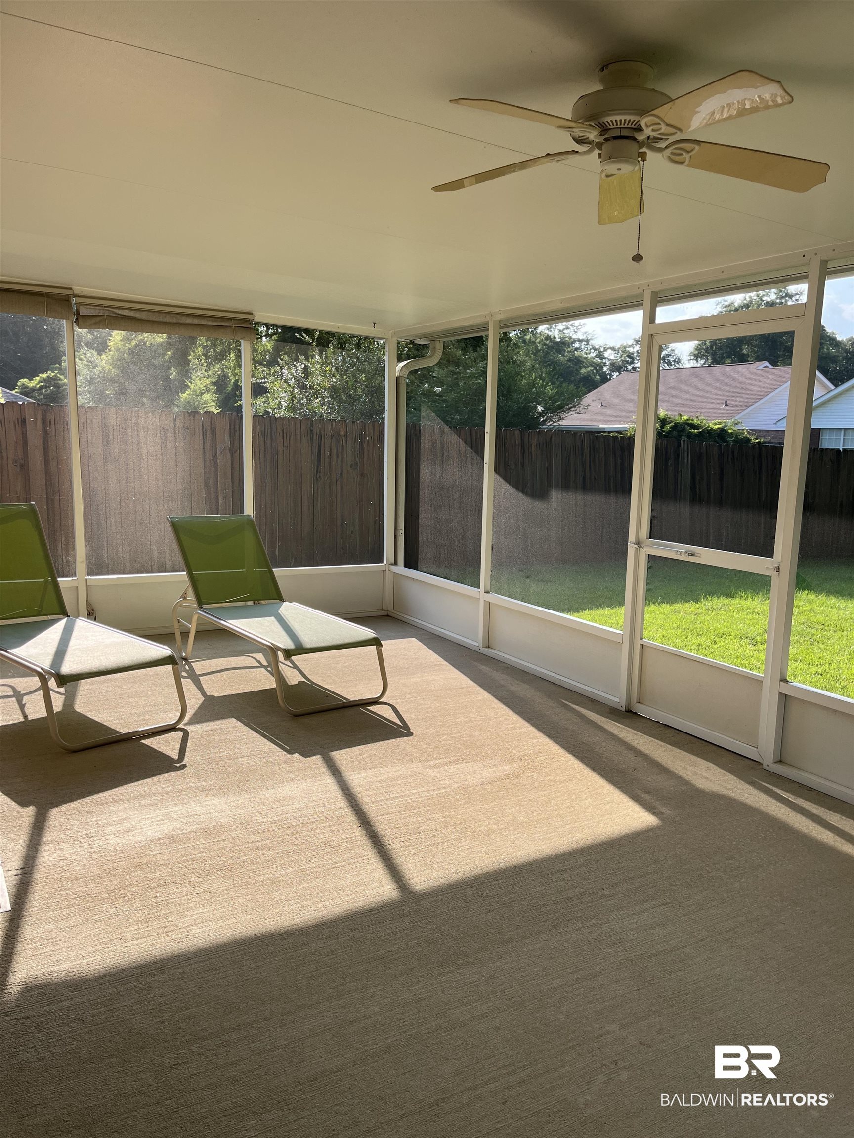 309 Cluster Street Foley, AL 36535 - Photo 38 of 38 Screened-in patio with light-colored carpeted flooring
