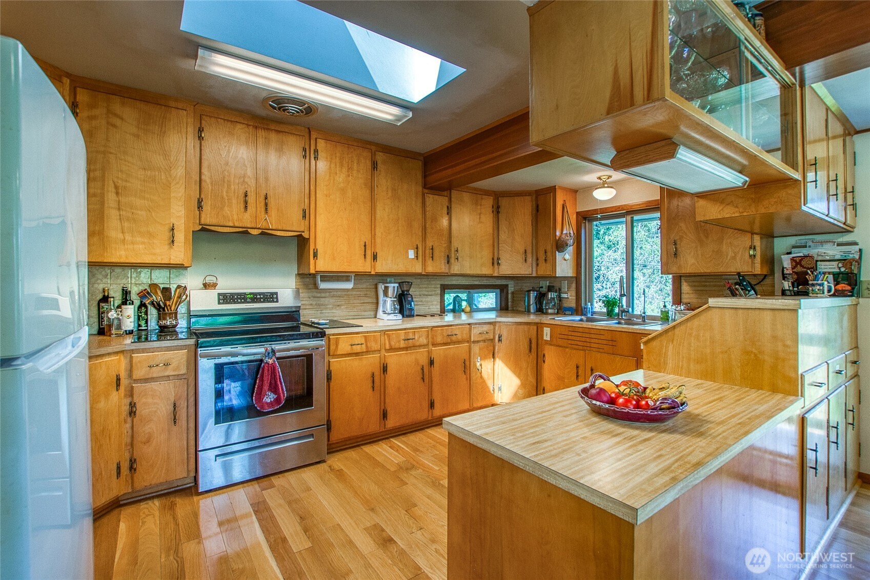 239 Killebrew Lake Road Orcas Island, WA 98280 - Photo 13 of 31 a kitchen with stainless steel appliances granite countertop a sink a stove and a refrigerator