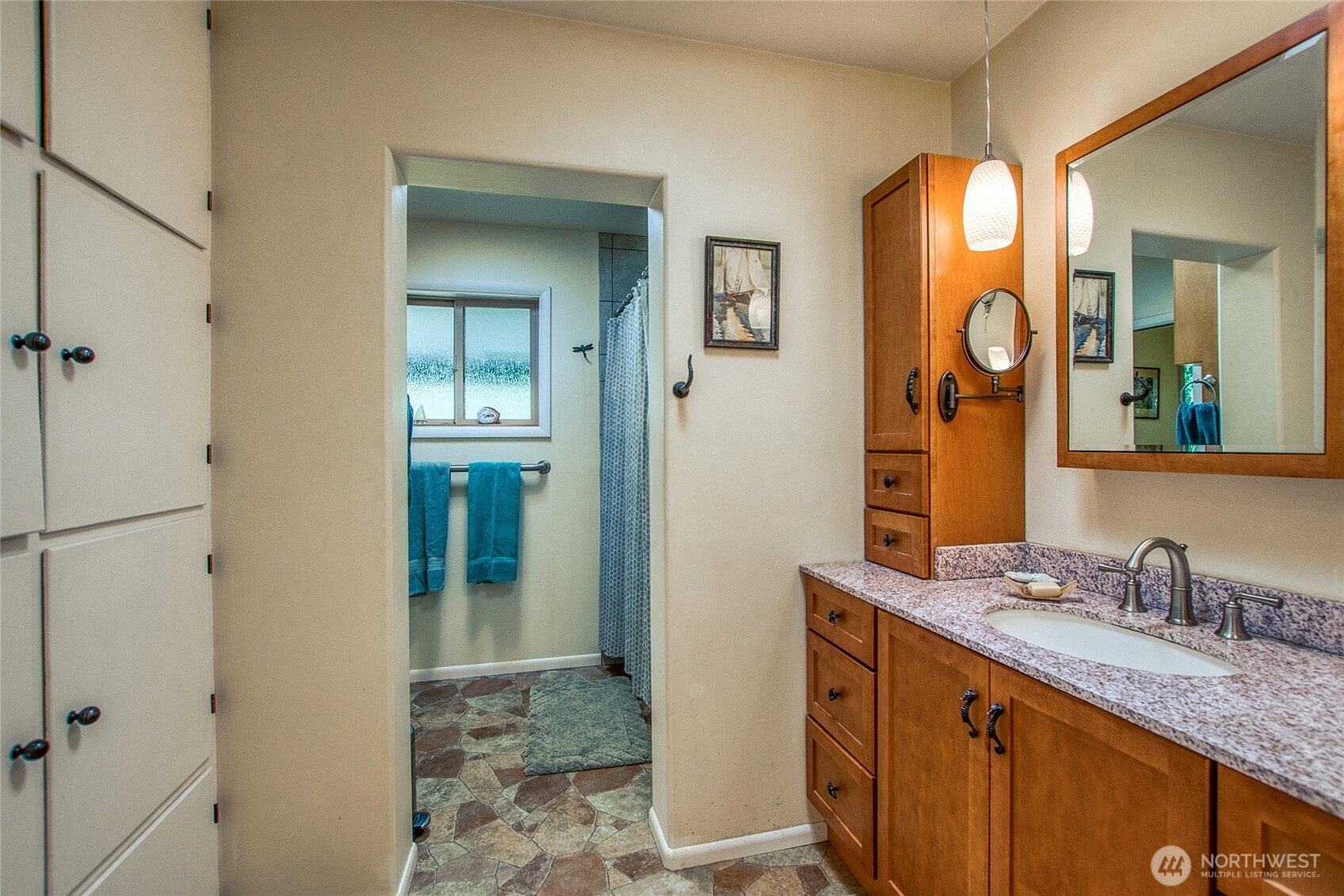 239 Killebrew Lake Road Orcas Island, WA 98280 - Photo 16 of 31 a bathroom with a granite countertop sink mirror and a shower