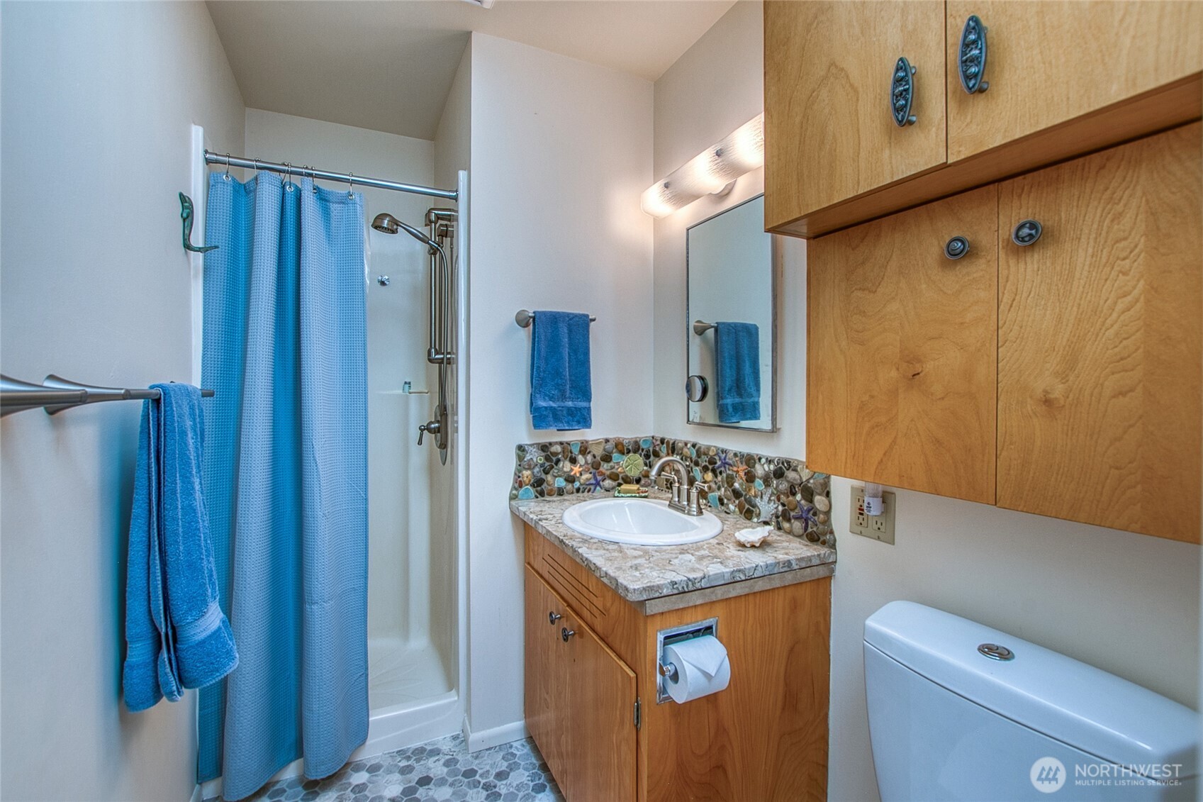 239 Killebrew Lake Road Orcas Island, WA 98280 - Photo 19 of 31 a bathroom with a granite countertop sink and a mirror