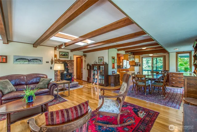 a living room with lots of furniture and a chandelier
