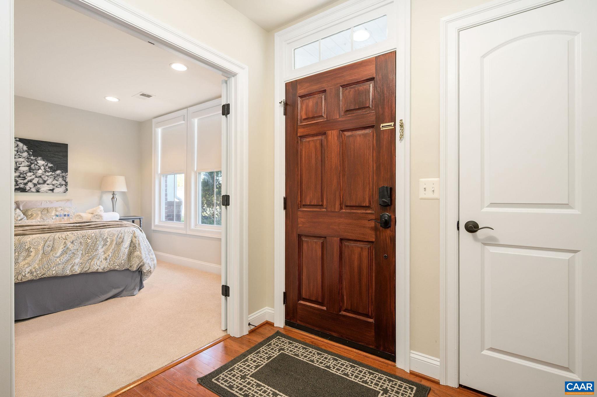 508 Tulip Tree Court Charlottesville, VA 22903 - Photo 2 of 35 a bedroom with a bed and a mirror