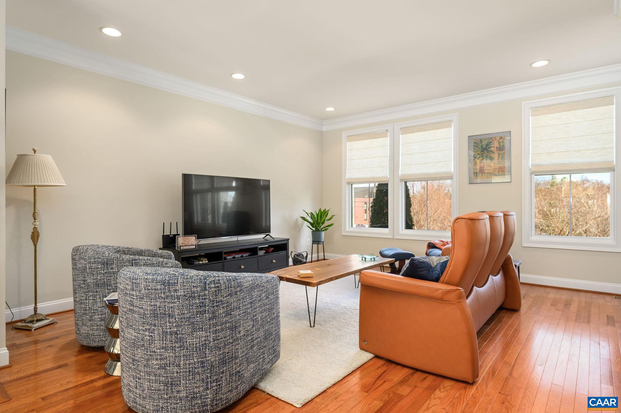 508 Tulip Tree Court Charlottesville, VA 22903 - Photo 7 of 35 a living room with furniture and a flat screen tv