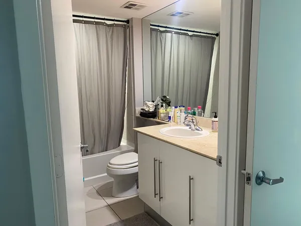 a bedroom with bed and a window