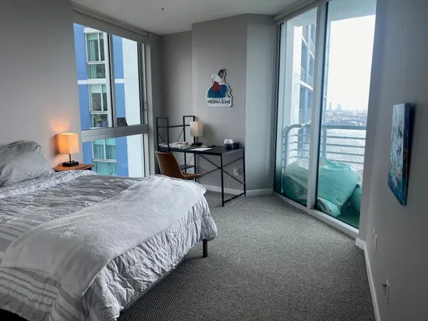 a bedroom with a bed and furniture