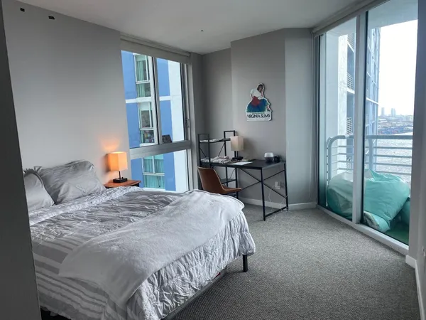 a view of a balcony with two chairs