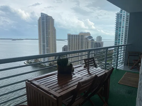 a view of a balcony with chairs