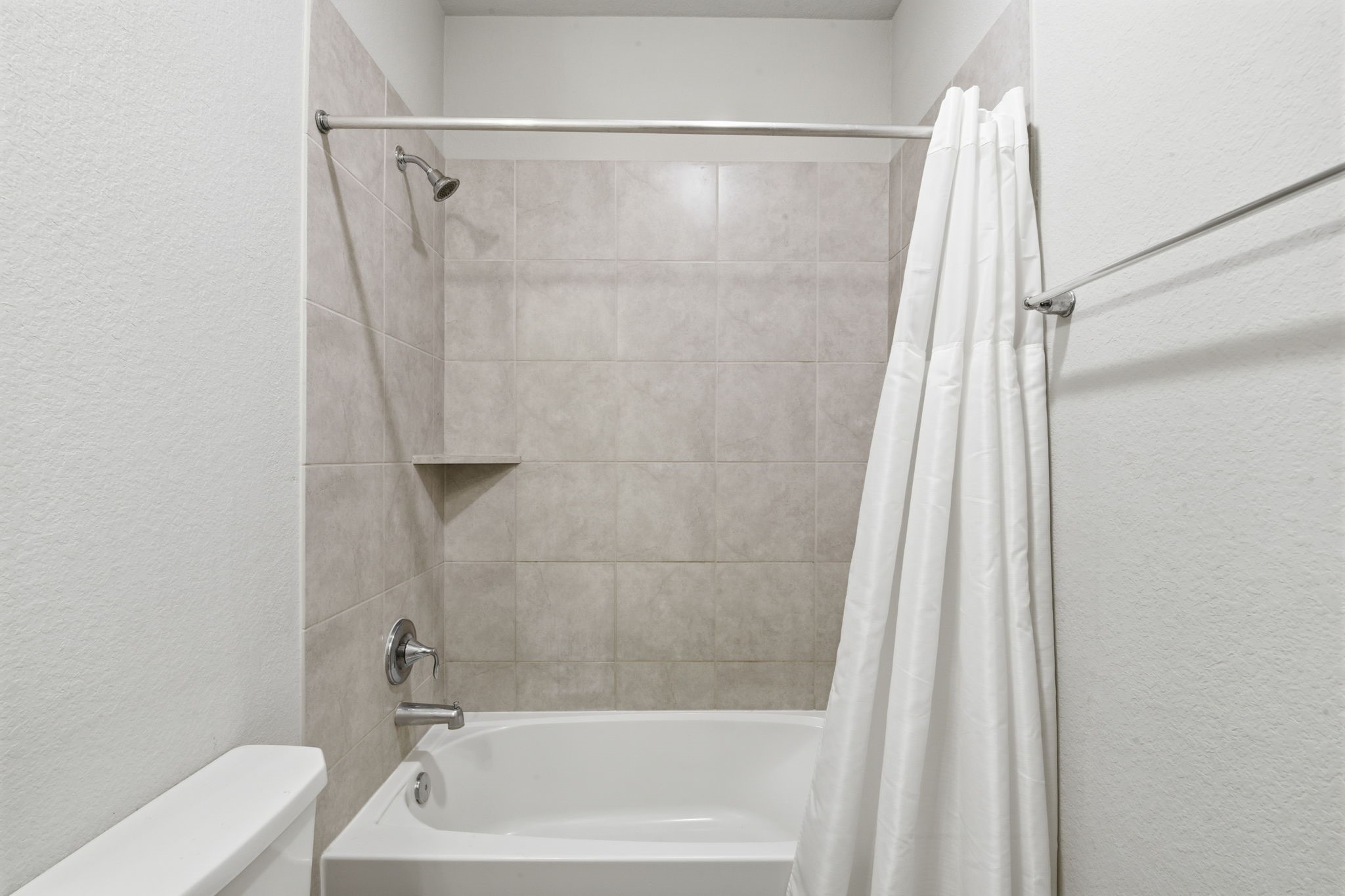 3410 Shockley Lane Rosharon, TX 77583 - Photo 27 of 32 a bathroom with a shower and a tub