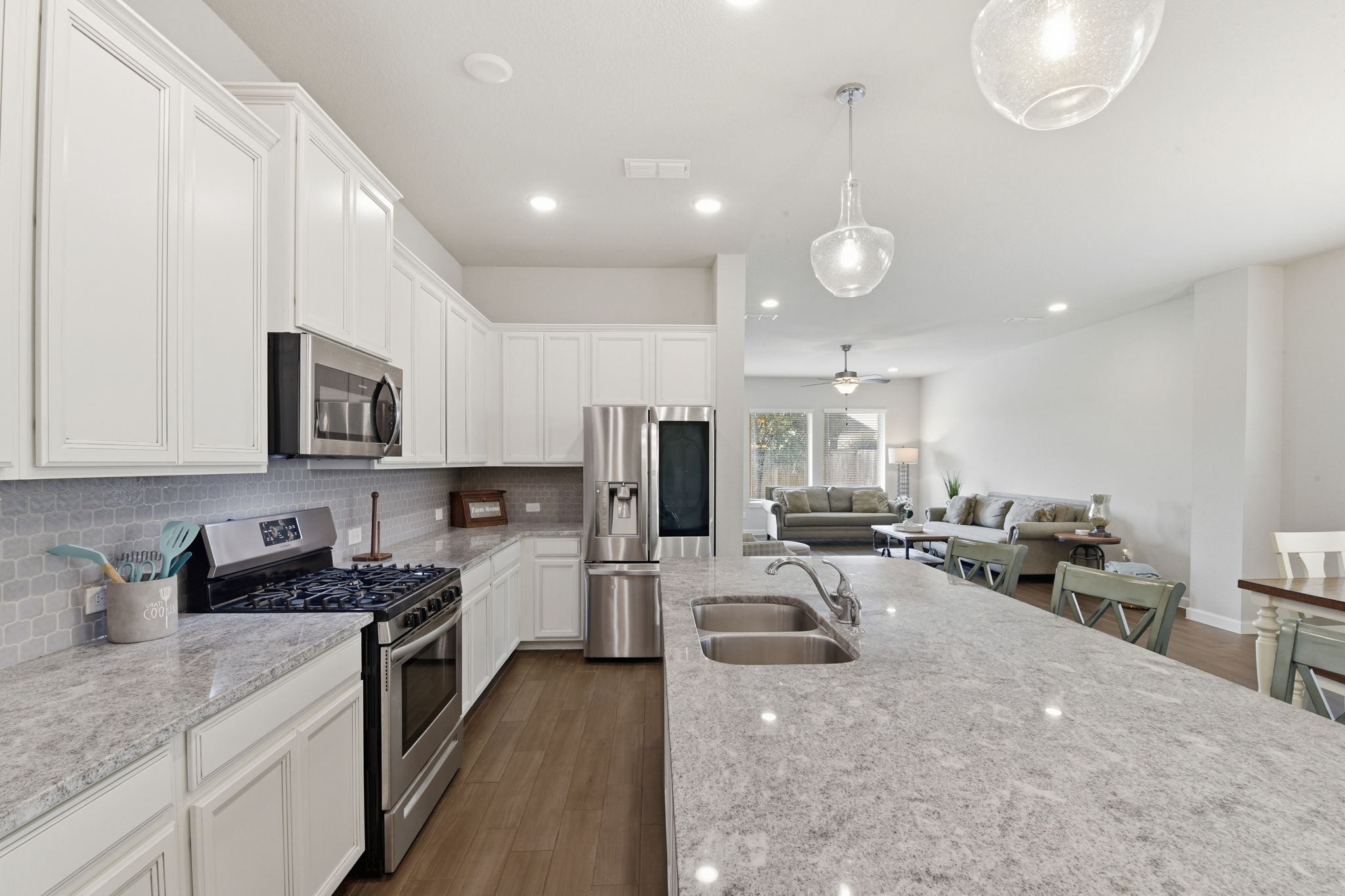 3410 Shockley Lane Rosharon, TX 77583 - Photo 10 of 32 a kitchen with furniture a center island stainless steel appliances cabinets and a counter top space