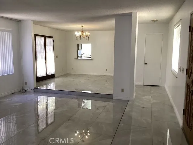 a view of a hallway with windows