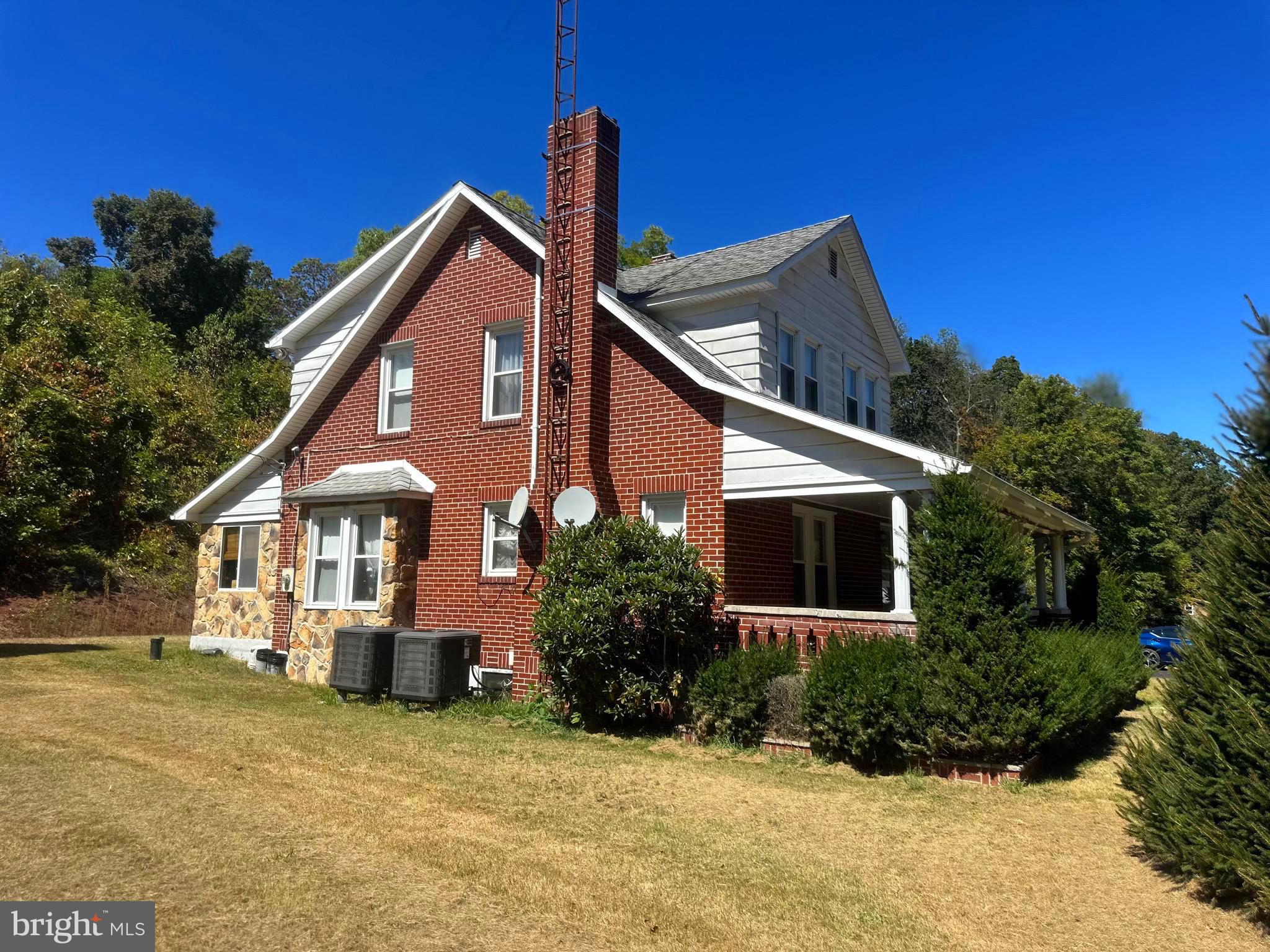 3500 Paw Paw Road Paw Paw, WV 25434 - Photo 2 of 48 a front view of a house with a yard