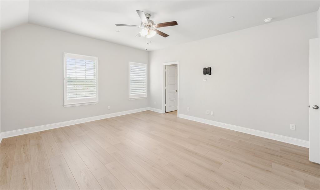 6020 Bursey Road Watauga, TX 76148 - Photo 20 of 33 wooden floor in an empty room with a window