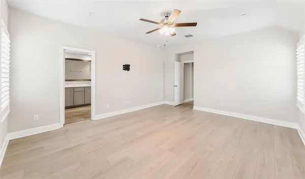 a view of an empty room with a bathroom