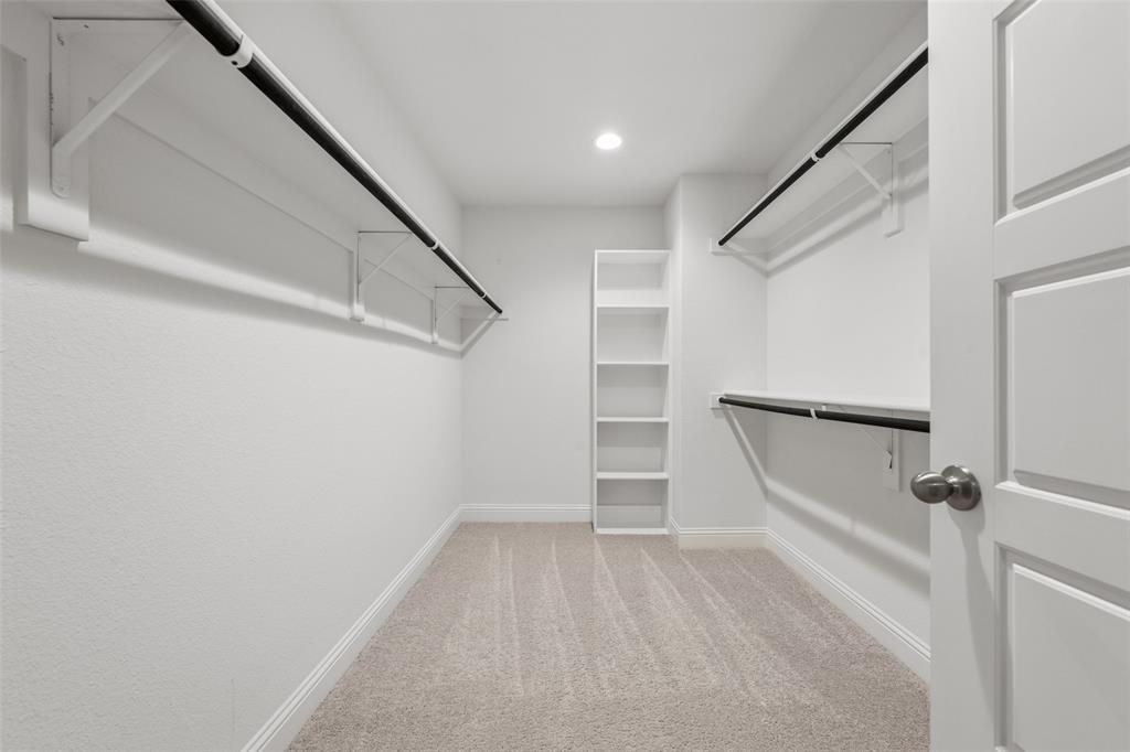 6020 Bursey Road Watauga, TX 76148 - Photo 24 of 33 a view of walk in closet with empty racks